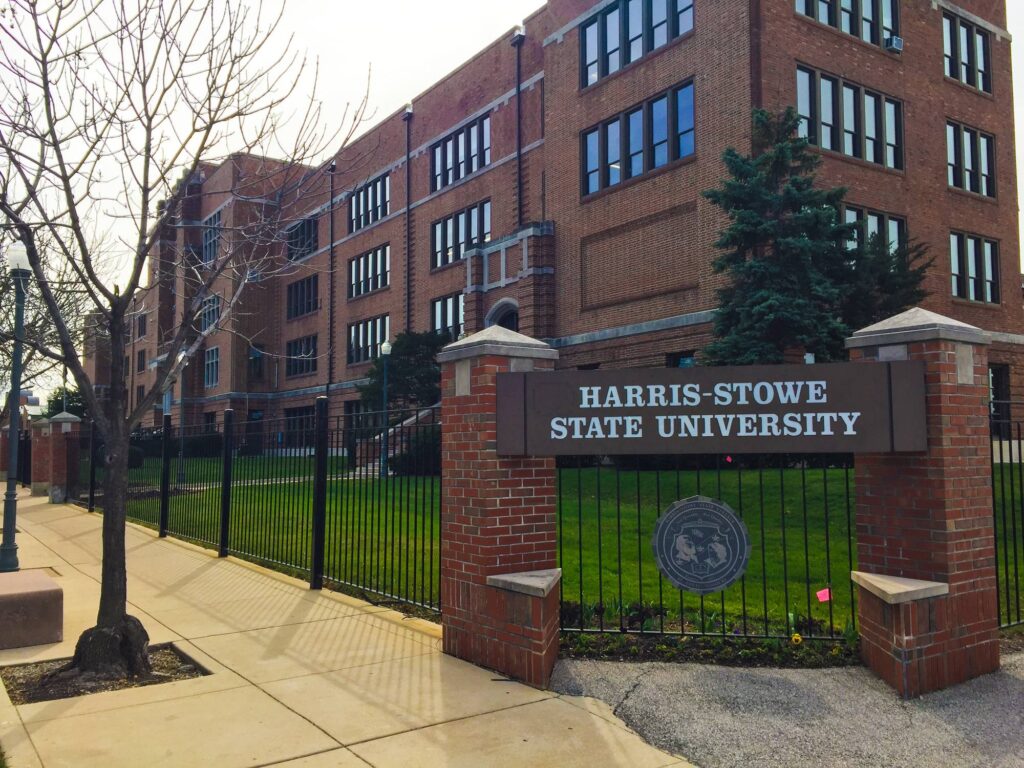 Campus entrance sign and academic building at Harris-Stowe State University